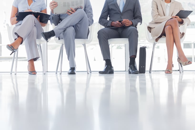 Group of well dressed business people waiting in waiting room